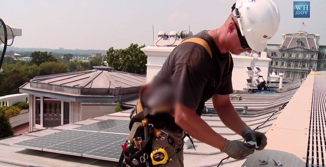 Photovoltaic solar panels being installed on the roof of the White House.